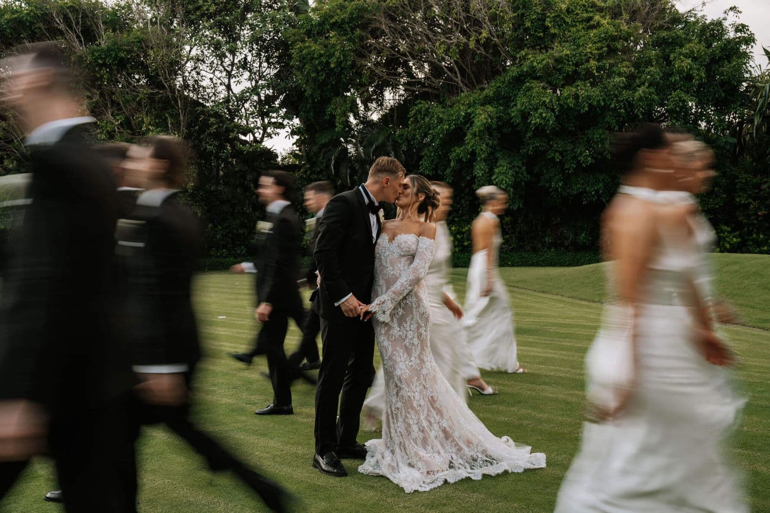 a couple in the middle of other people