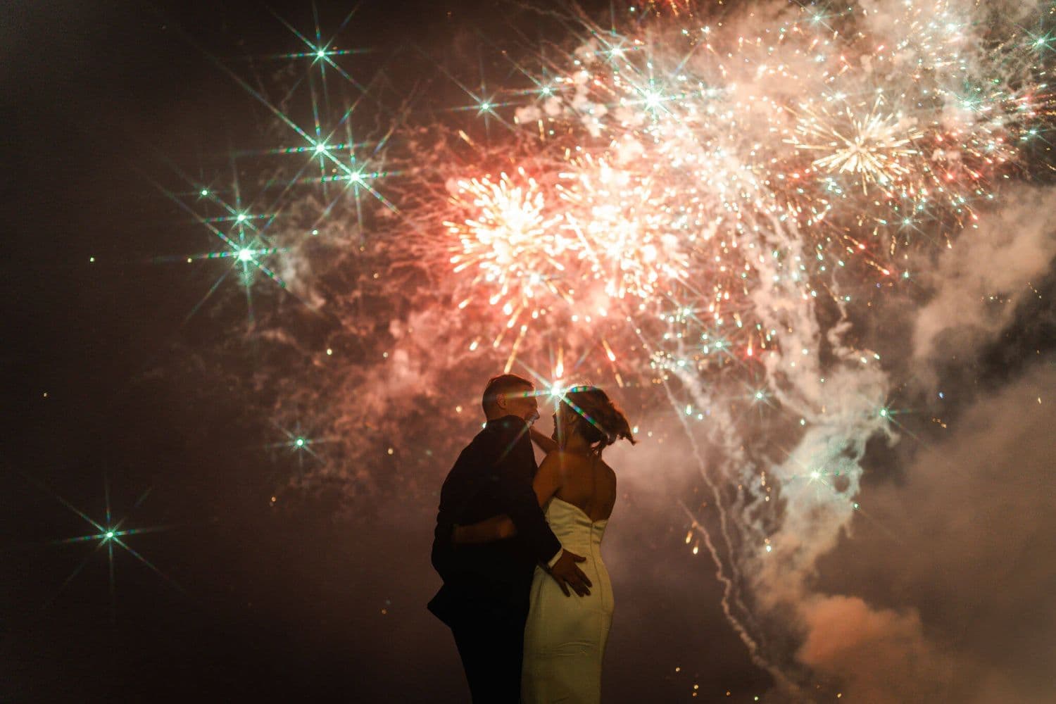Georgie and Taylor wedding at The Ungasan with firework in the background
